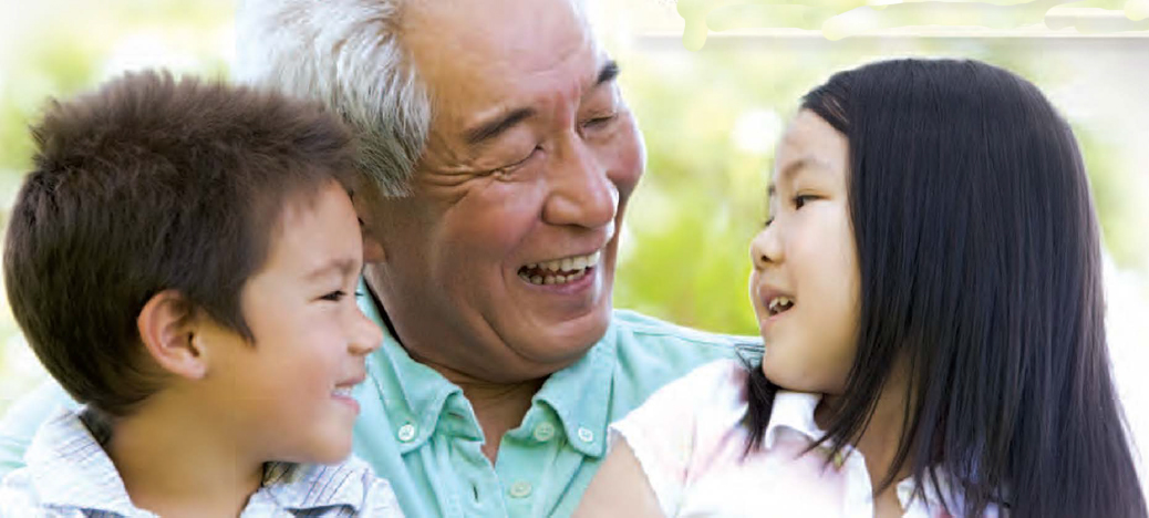 Grandpa and grandkids smiling at each other