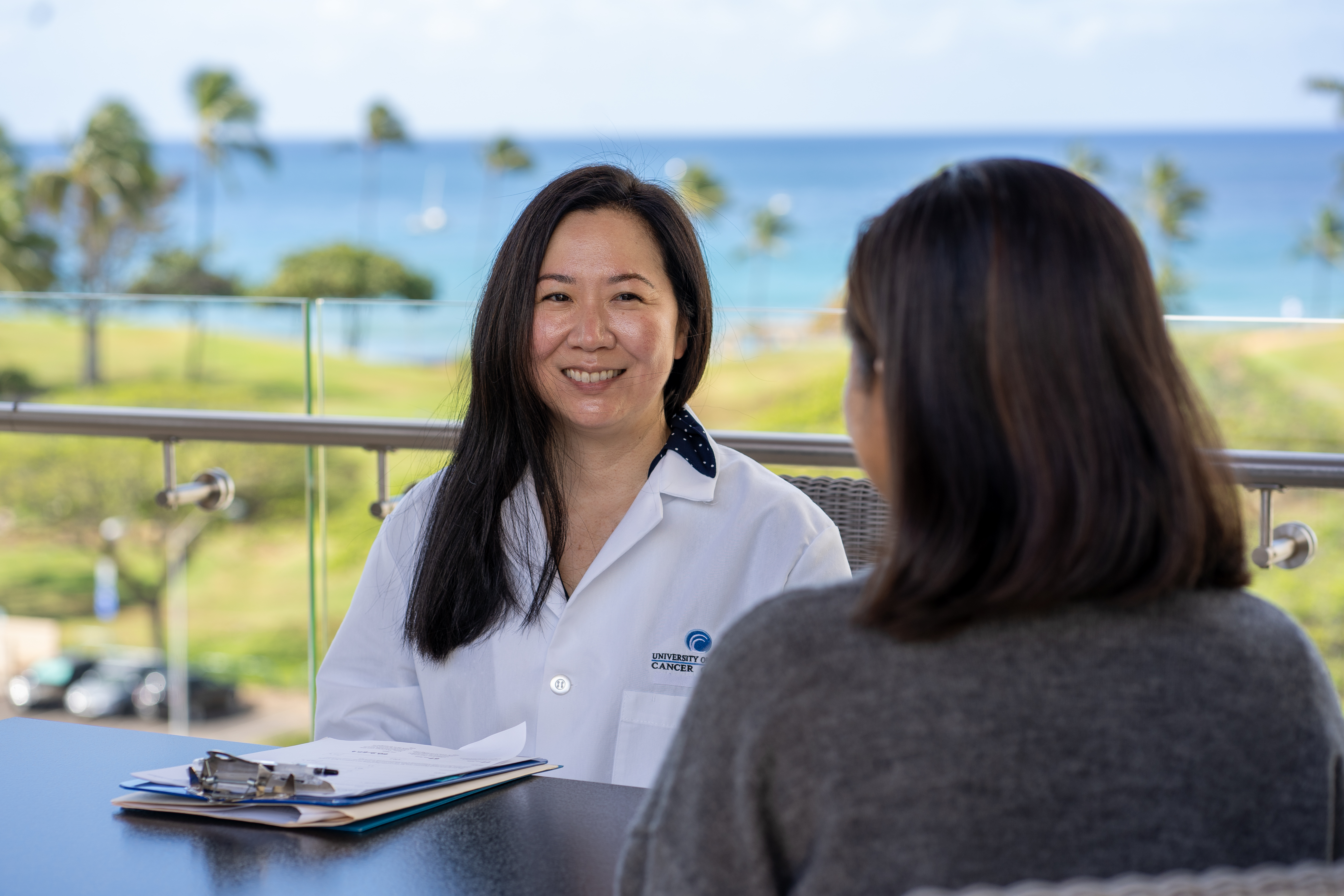Janice Yonamine, CRA, with a patient
