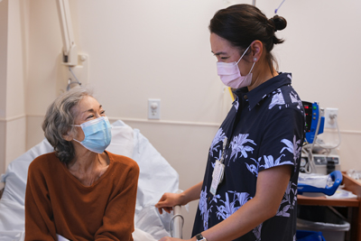 Dr. Si Lim with a patient