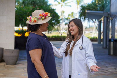 Dr. Jami Fukui speaking with a patient